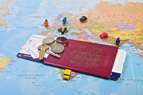 Passport and travel documents on map